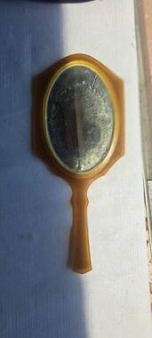 Vintage early plastic/celluloid-style vanity mirror, likely dating from the earl